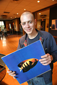 Hamish Macmillan with a vinyl record by 808 State