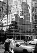 Artistic photograph of a building reflecting in another