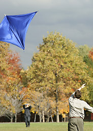 Kevin Labyt (foreground) and Yannick Fortin hoist their kite aloft at Macdonald Campus on a brisk autumn day. The two John Abbott College students were doing work for a science course.