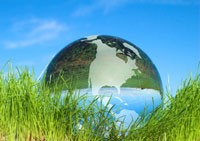 A crystal globe seen up-close in fresh green grass